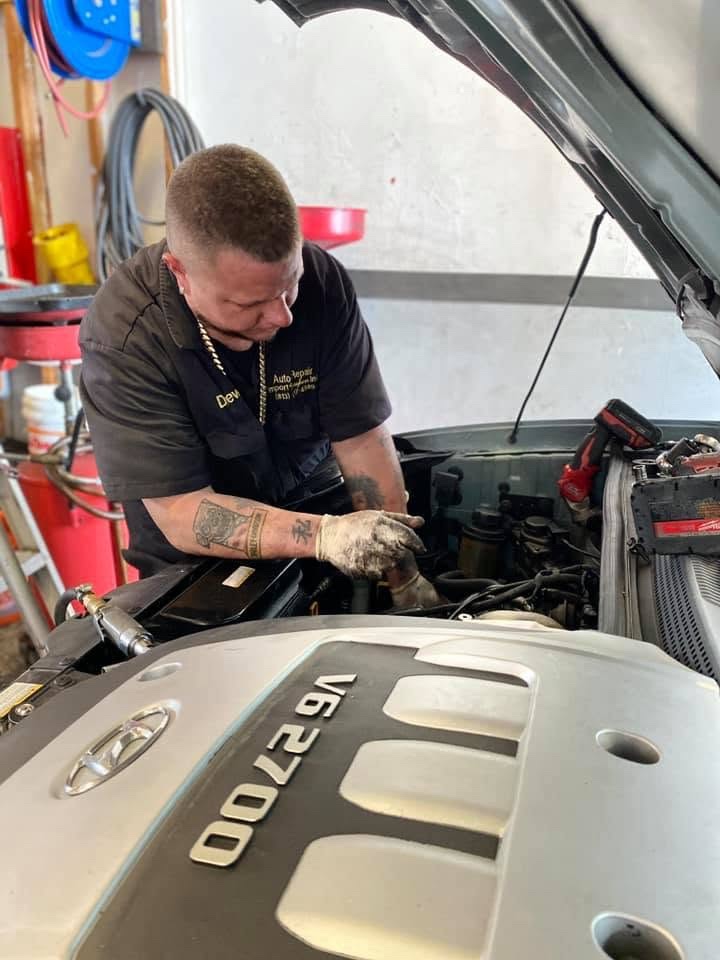 Andrew Stagman working on a vehicle at Import Mayhem.
